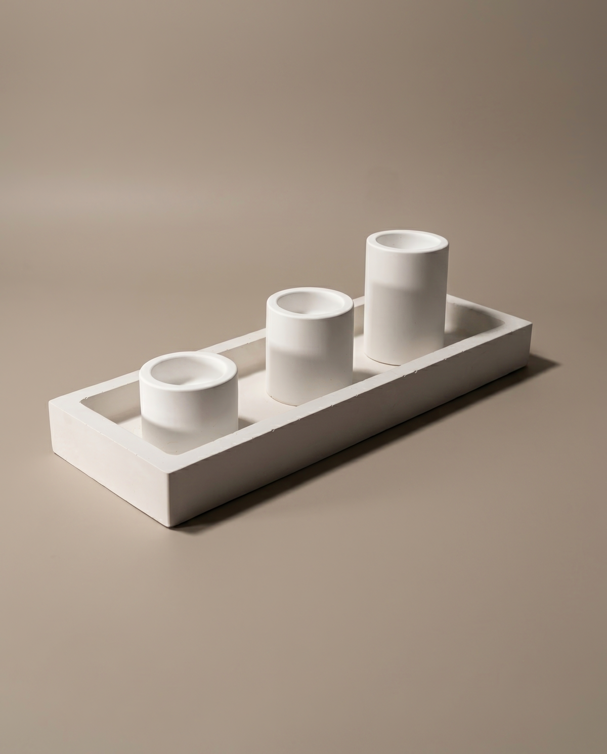 Trio handmade set of three matte white cylinder candle holders on a rectangular tray by GlowBaltic