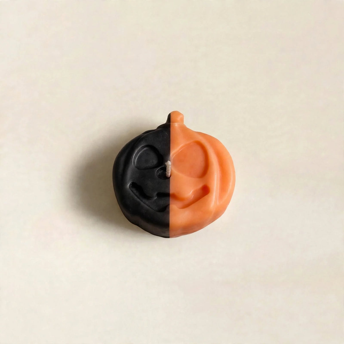 Jack handmade Halloween candle by Glowbaltic, hand-poured black and orange rapeseed wax jack-o'-lantern pumpkin candle