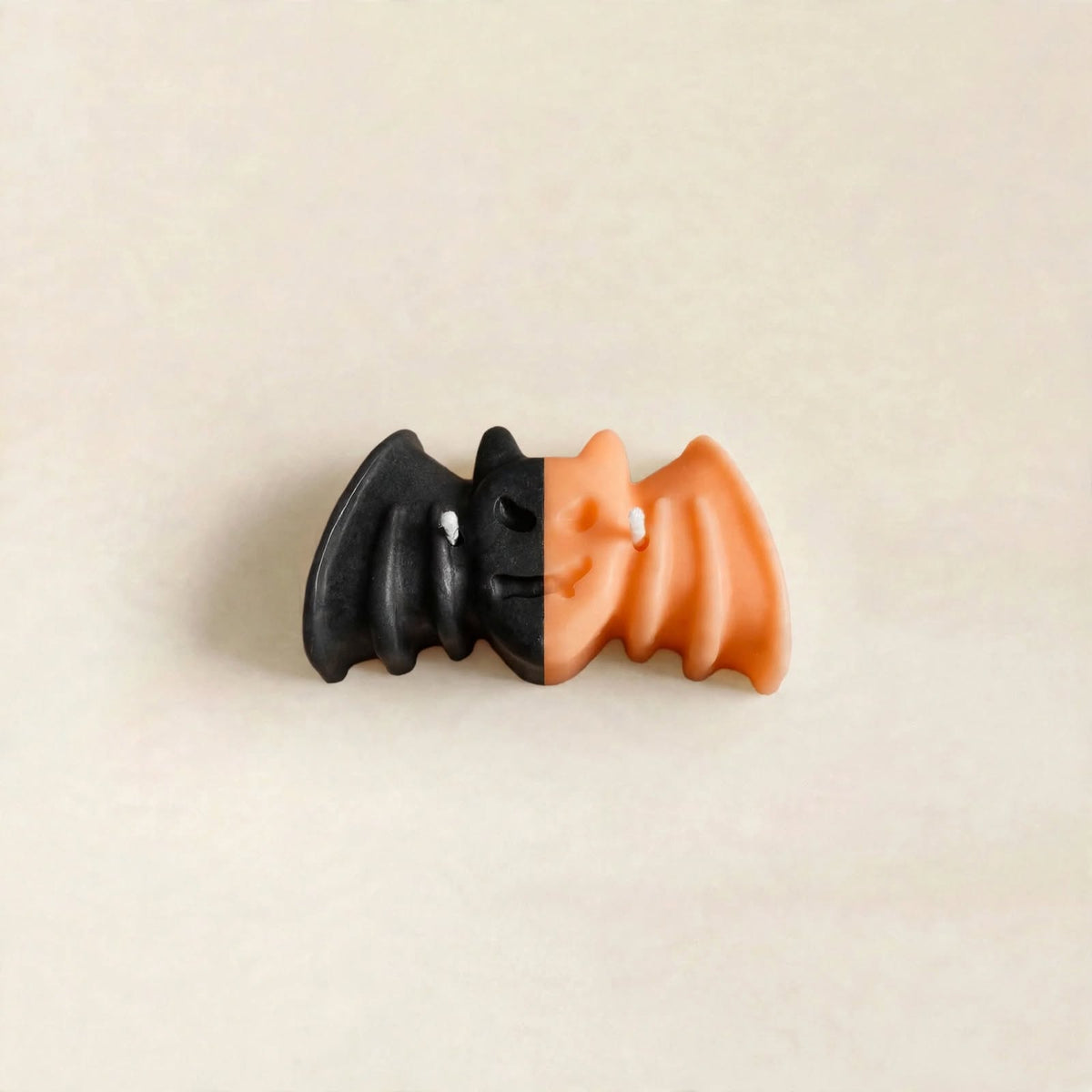 Nox handmade Halloween candle by Glowbaltic, hand-poured black and orange rapeseed wax bat candle with two wicks