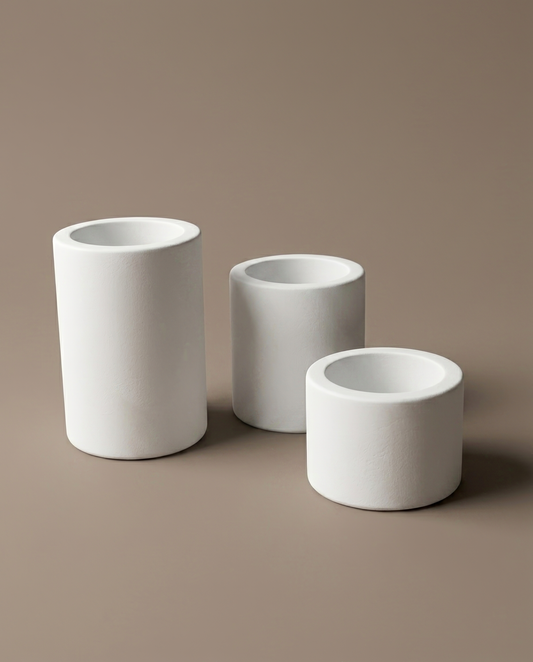 Amber set of three handmade matte white cylindrical candle holders by GlowBaltic