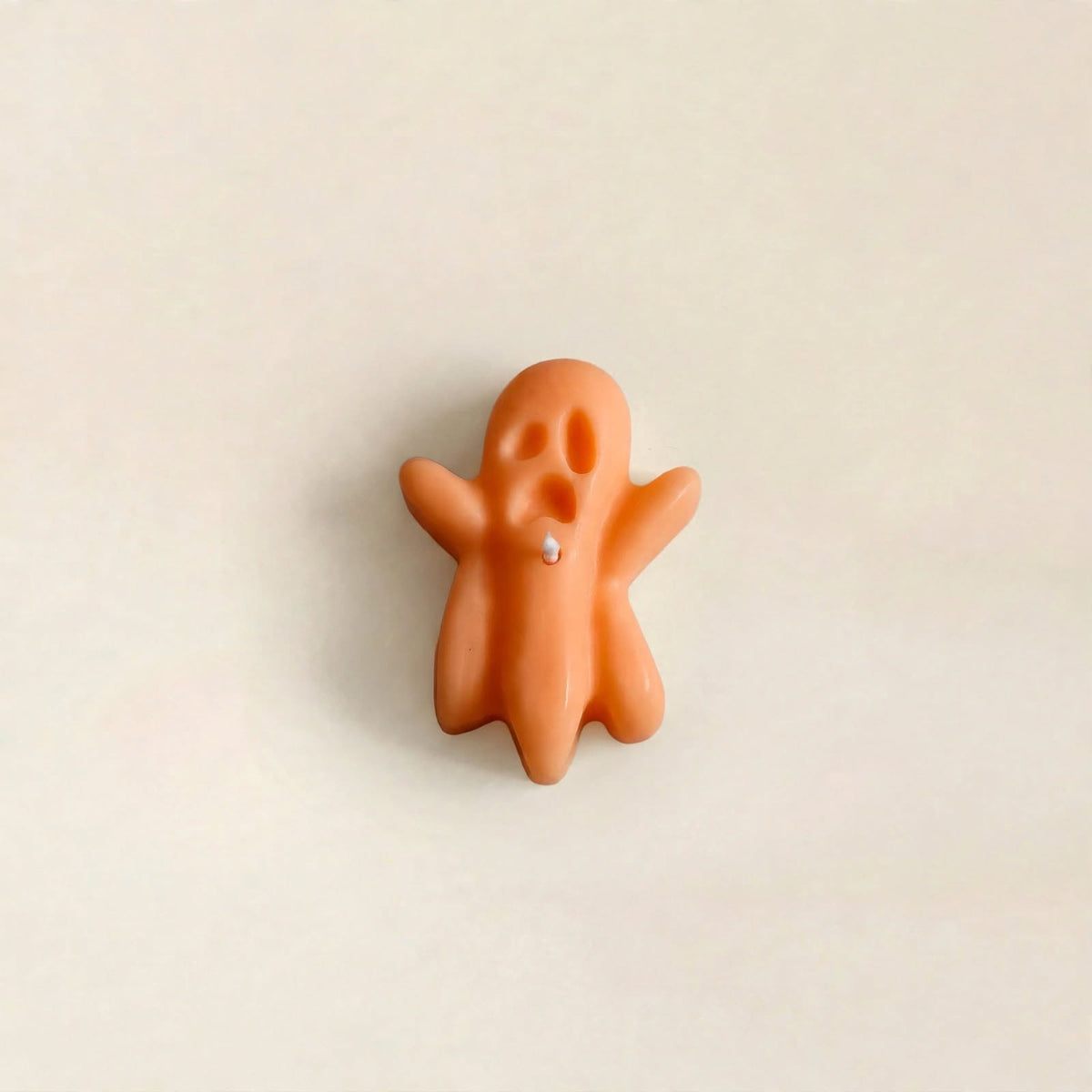 Banshee handmade Halloween candle by Glowbaltic, hand-poured orange rapeseed wax ghost candle with raised arms