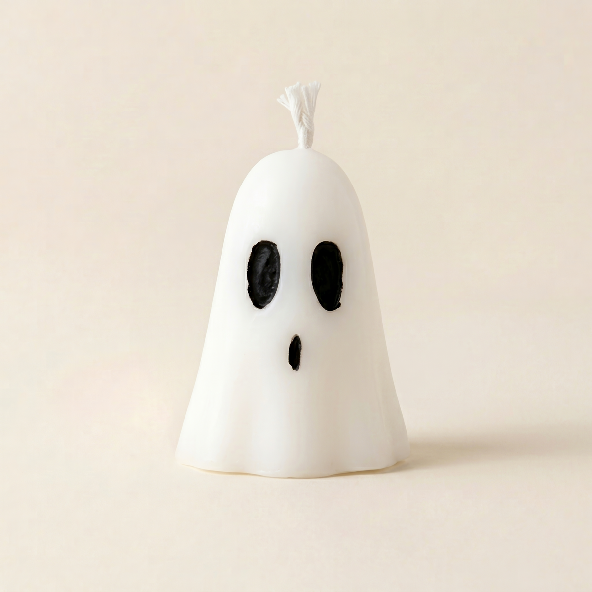 Boo handmade mini ghost candle, smooth white wax with black mouth and eyes by Glowbaltic