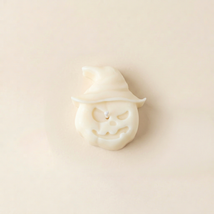 Hex handmade Halloween candle by Glowbaltic, hand-poured white rapeseed wax pumpkin candle in a witch's hat