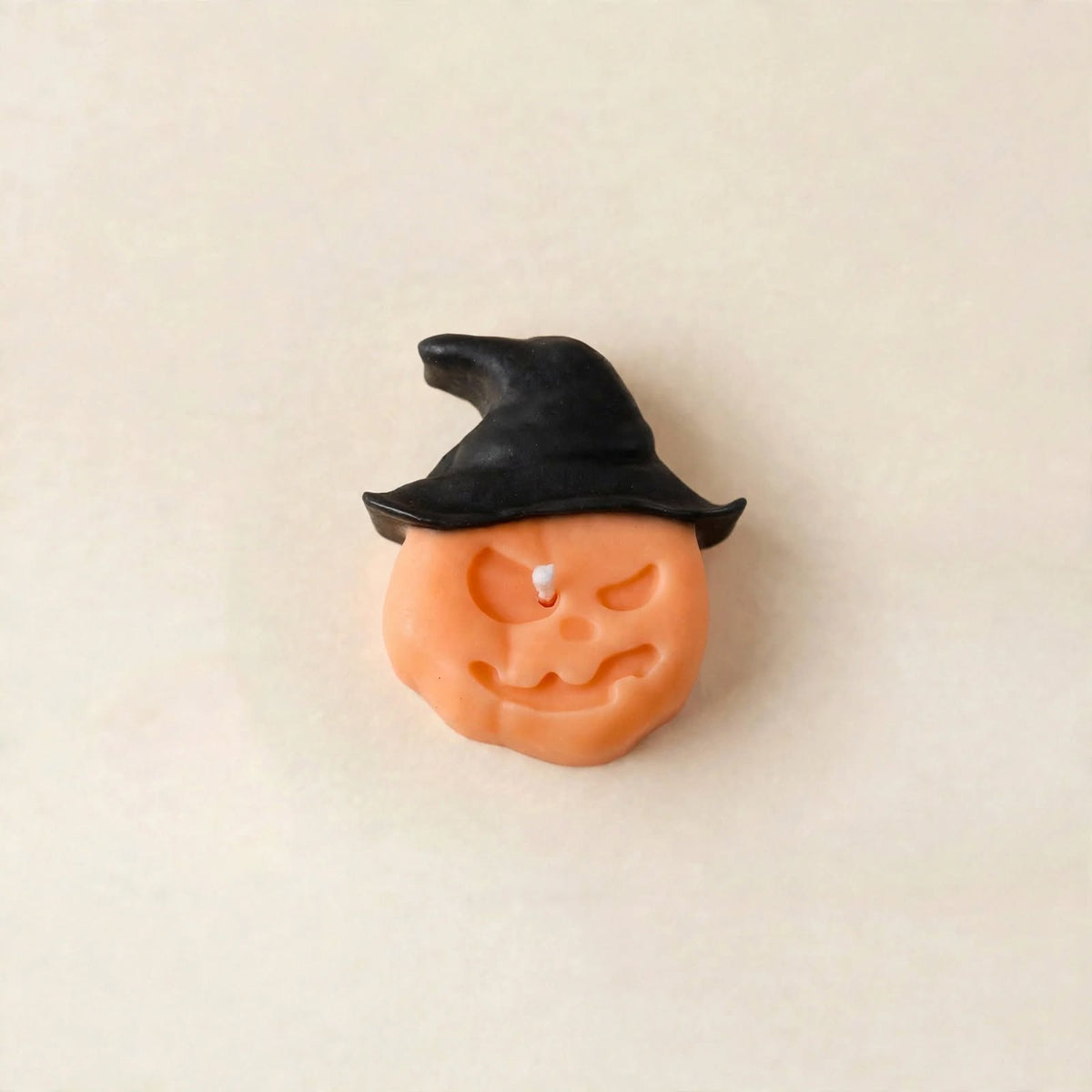 Hex handmade Halloween candle by Glowbaltic, hand-poured black and orange rapeseed wax pumpkin candle in a witch's hat