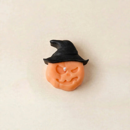 Hex handmade Halloween candle by Glowbaltic, hand-poured black and orange rapeseed wax pumpkin candle in a witch's hat