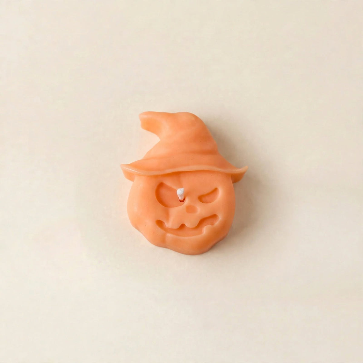 Hex handmade Halloween candle by Glowbaltic, hand-poured orange rapeseed wax pumpkin candle in a witch's hat