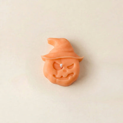 Hex handmade Halloween candle by Glowbaltic, hand-poured orange rapeseed wax pumpkin candle in a witch's hat