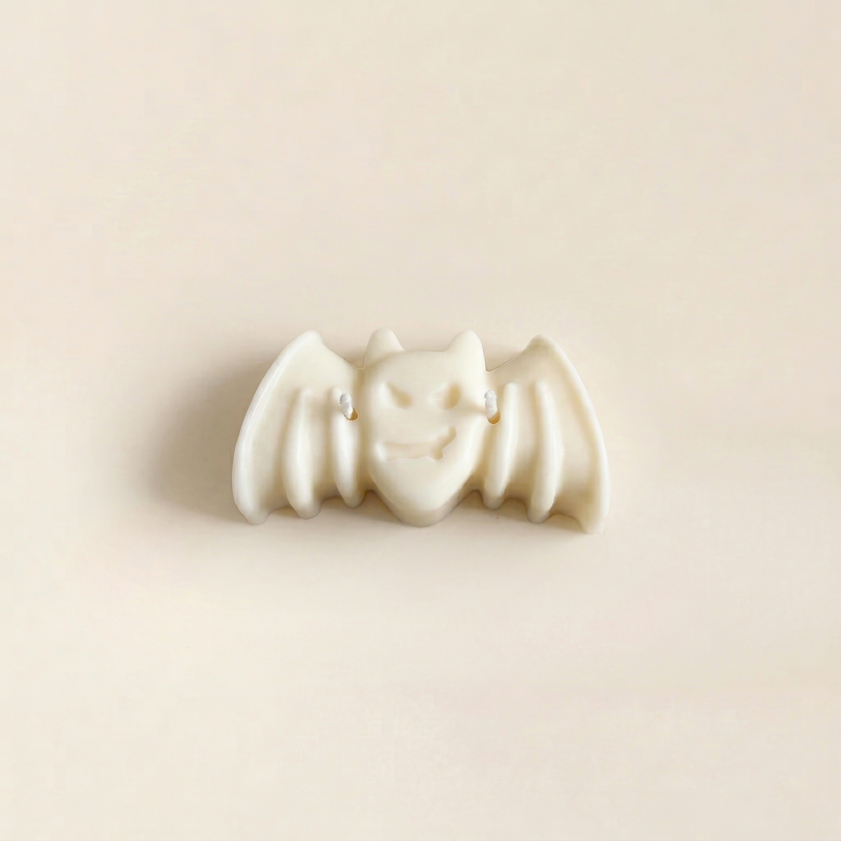 Nox handmade Halloween candle by Glowbaltic, hand-poured white rapeseed wax bat candle with two wicks