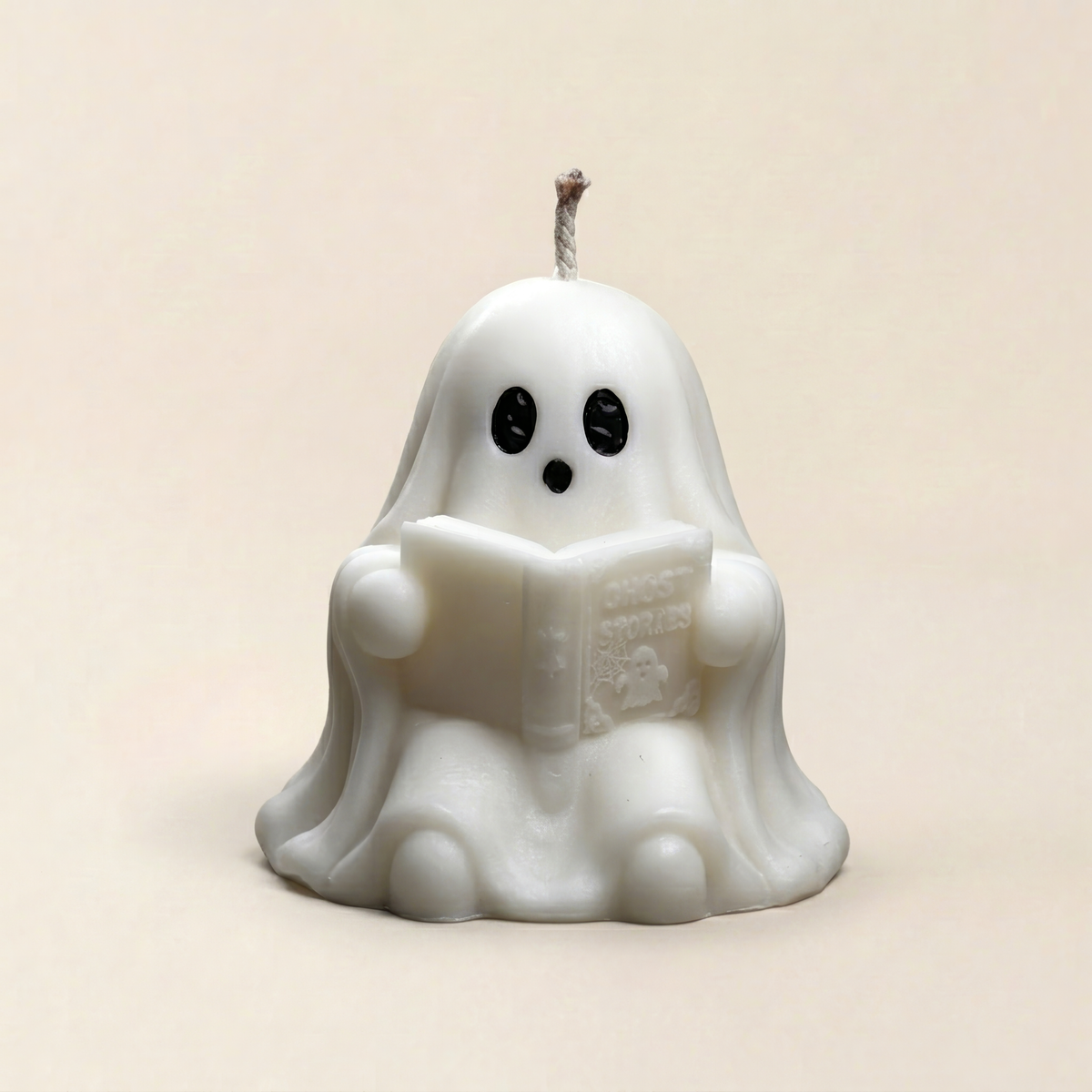 Handmade Storytime ghost candle for halloween by Glowbaltic reading Ghost Stories book