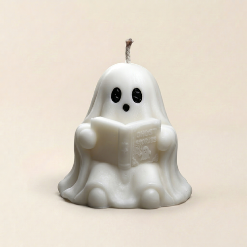 Handmade Storytime ghost candle for halloween by Glowbaltic reading Ghost Stories book