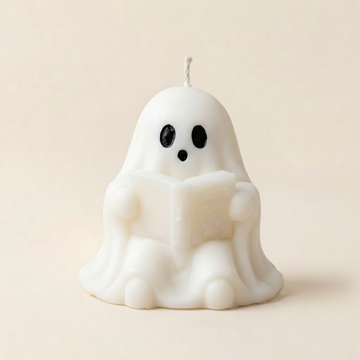 Handmade Storytime ghost candle for halloween by Glowbaltic reading Ghost Stories book