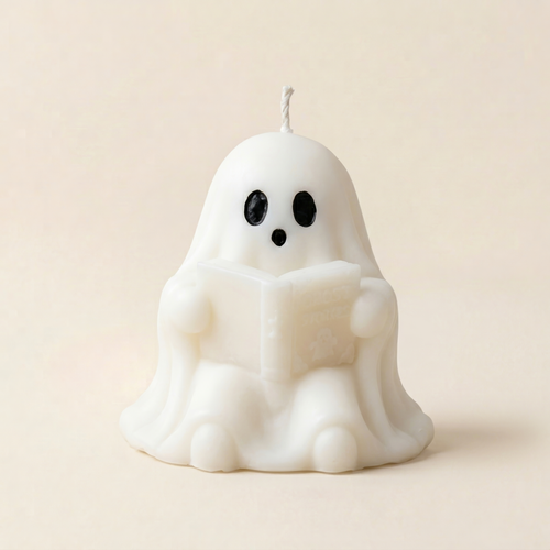 Handmade Storytime ghost candle for halloween by Glowbaltic reading Ghost Stories book