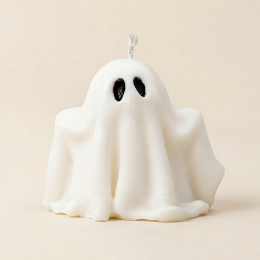 Wisp handmade ghost candle, draped white wax silhouette with black eyes by Glowbaltic