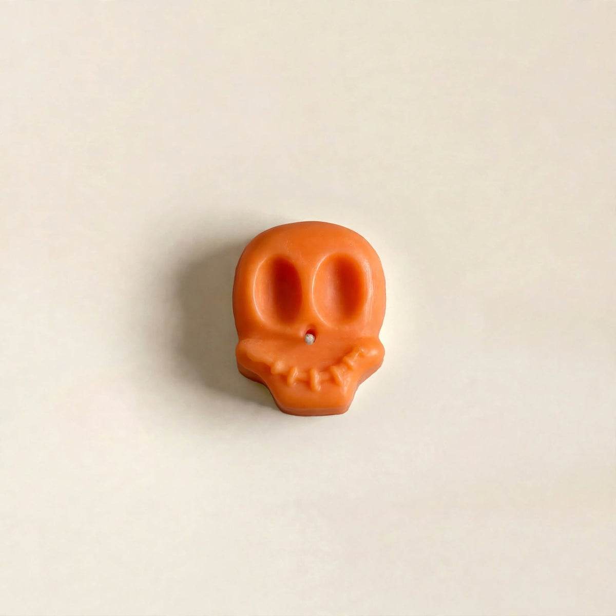 Yorick handmade Halloween candle by Glowbaltic, hand-poured orange rapeseed wax skull candle